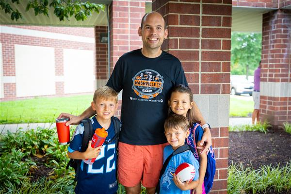 dad and two students walking into WGES